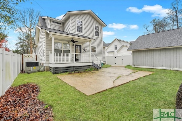 back of house with ceiling fan, central air condition unit, a yard, a fenced backyard, and a patio