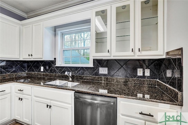 kitchen featuring glass insert cabinets, dishwasher, dark stone counters, white cabinets, and a sink