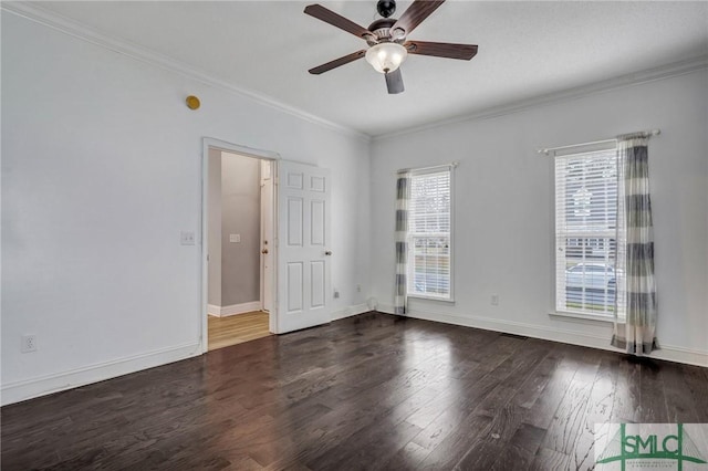 unfurnished room featuring ceiling fan, baseboards, wood finished floors, and ornamental molding