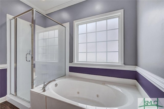 bathroom with a stall shower and a whirlpool tub