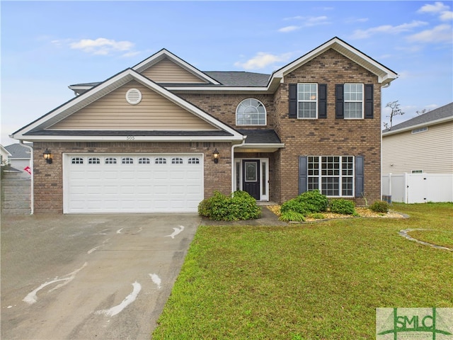 traditional-style house featuring brick siding, concrete driveway, a front yard, and fence