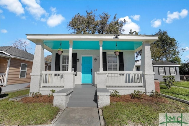 bungalow featuring covered porch