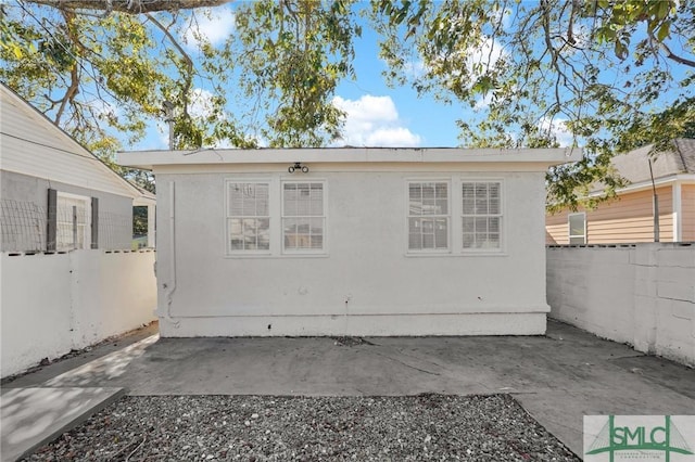 exterior space with a patio and fence