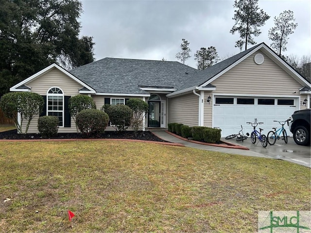 ranch-style home featuring a garage, roof with shingles, and a front lawn