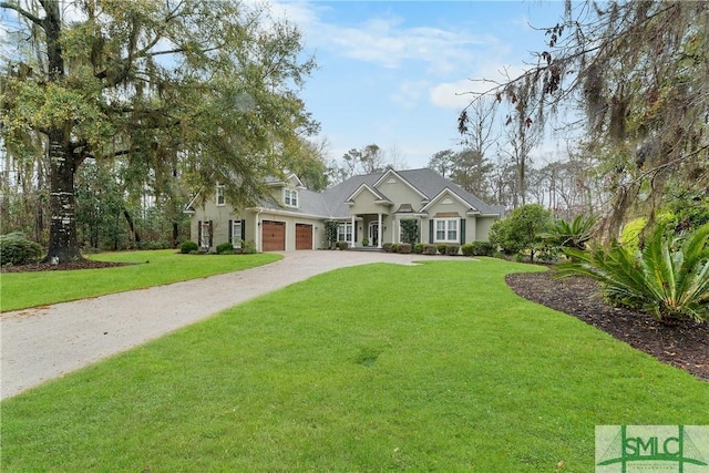 craftsman-style house with a front yard, an attached garage, and driveway