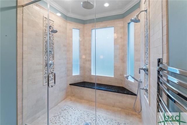 bathroom featuring a shower stall and crown molding