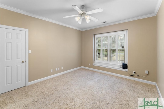 empty room featuring carpet flooring, baseboards, visible vents, and ornamental molding