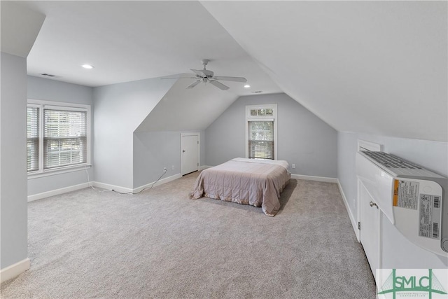 bedroom featuring visible vents, baseboards, multiple windows, and carpet floors