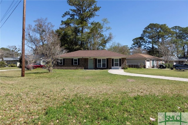 ranch-style house featuring a front lawn and brick siding