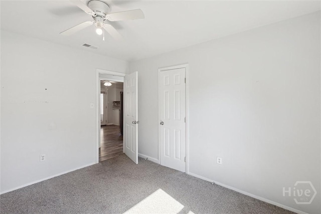 7014 Key St, Savannah, GA 31406 - unfurnished bedroom with carpet floors, baseboards, and a ceiling fan