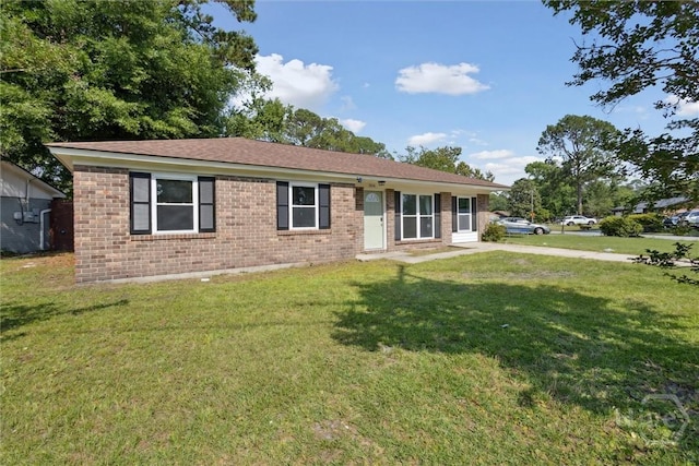 7014 Key St, Savannah, GA 31406 - ranch-style house with brick siding, a front lawn, and roof with shingles