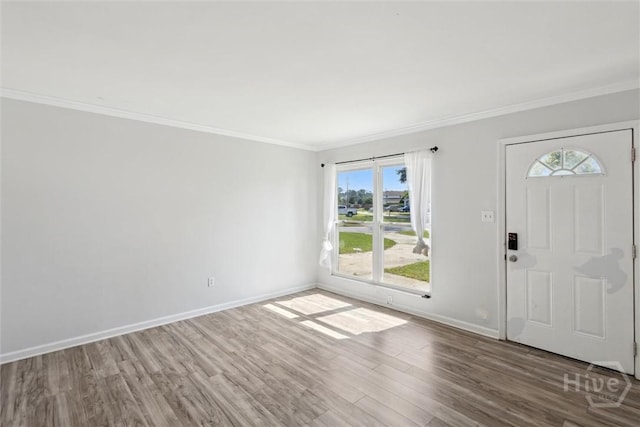 7014 Key St, Savannah, GA 31406 - foyer entrance featuring plenty of natural light, wood finished floors, ornamental molding, and baseboards