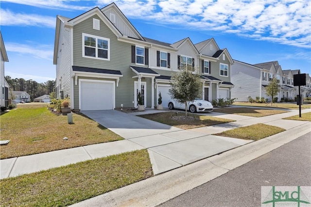 view of property with board and batten siding, a residential view, a front yard, driveway, and an attached garage