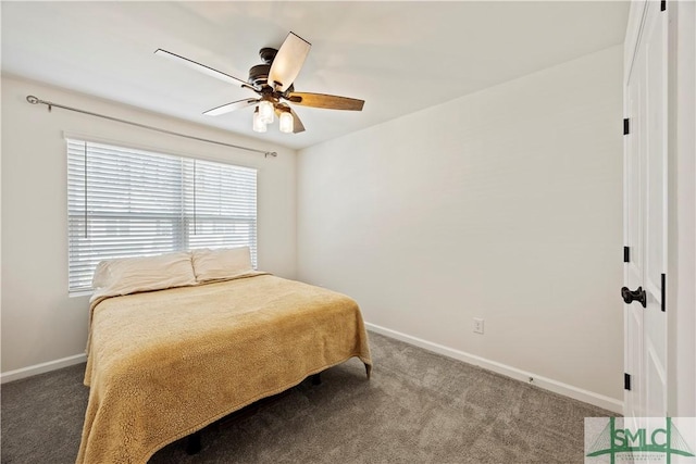 carpeted bedroom featuring ceiling fan and baseboards