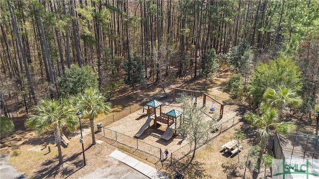 drone / aerial view featuring a forest view