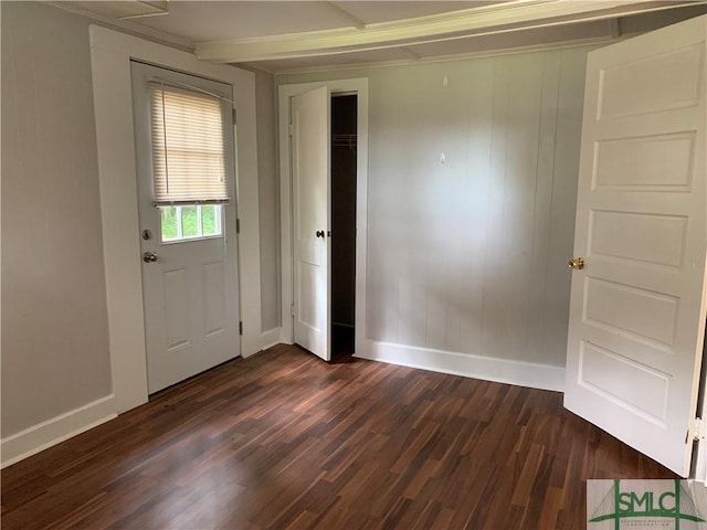 interior space featuring dark wood-style floors and baseboards