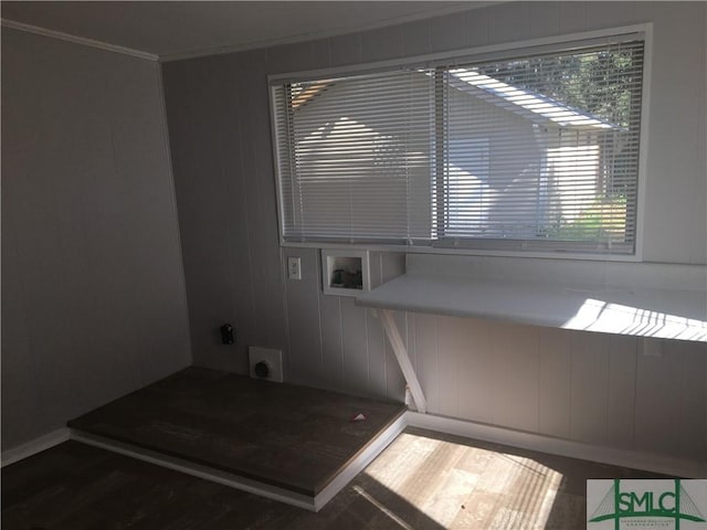 interior space featuring laundry area, ornamental molding, hookup for an electric dryer, and washer hookup