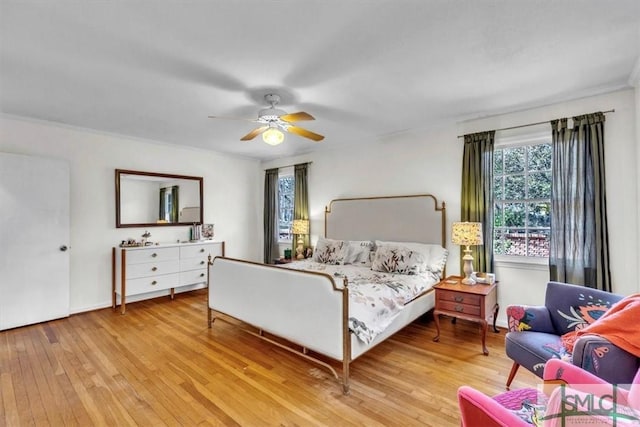 bedroom featuring hardwood / wood-style flooring and ceiling fan