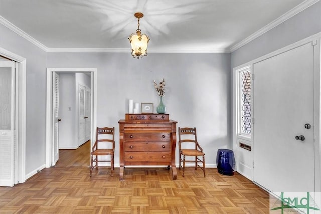 sitting room featuring baseboards, an inviting chandelier, and crown molding