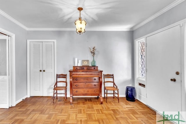 living area featuring an inviting chandelier, baseboards, and ornamental molding