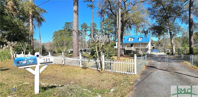 view of road featuring a gated entry and a gate