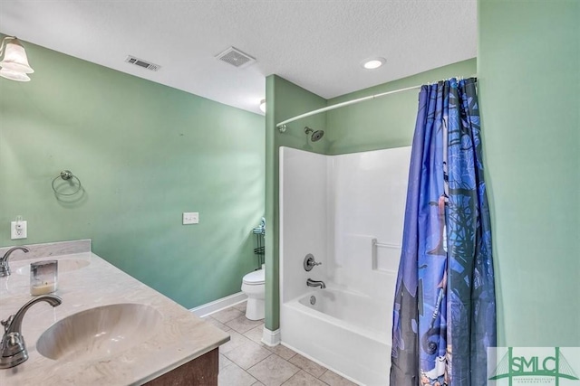 bathroom featuring tile patterned flooring, visible vents, and a sink