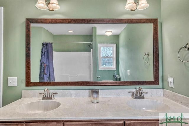 bathroom featuring double vanity and a sink