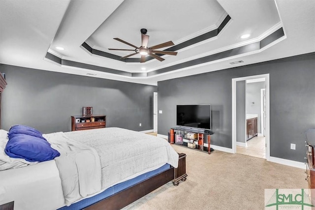 bedroom with visible vents, a raised ceiling, carpet, and ornamental molding