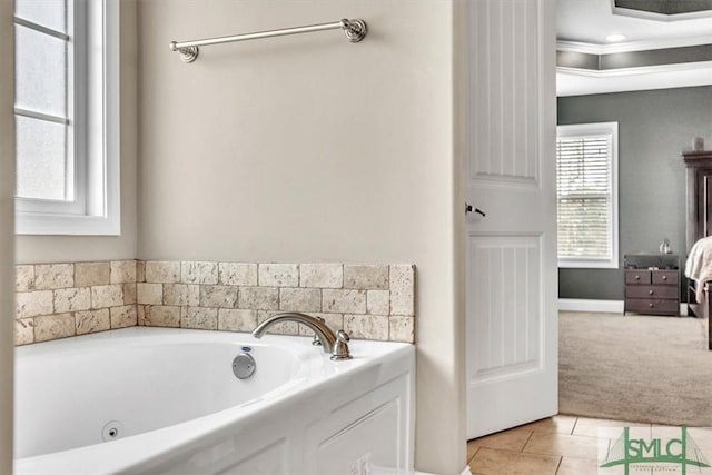 full bathroom featuring tile patterned floors, a garden tub, and ornamental molding