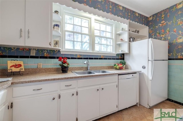 kitchen featuring white appliances, wallpapered walls, open shelves, a sink, and white cabinets