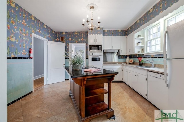 kitchen featuring wallpapered walls, open shelves, a wainscoted wall, and white appliances