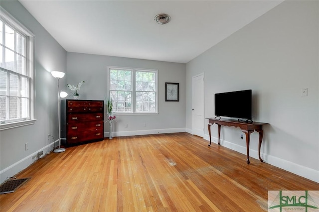 unfurnished bedroom featuring light wood-style flooring, baseboards, and visible vents