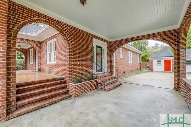 view of patio / terrace with an outdoor structure and entry steps