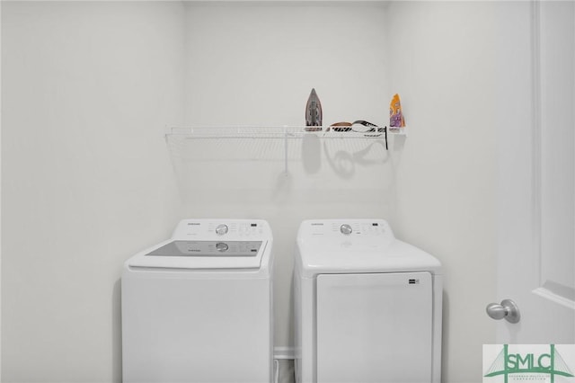 laundry area with laundry area and independent washer and dryer