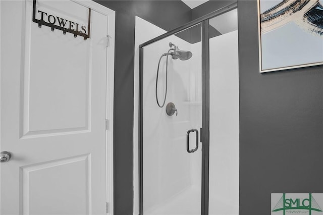 bathroom featuring a shower stall