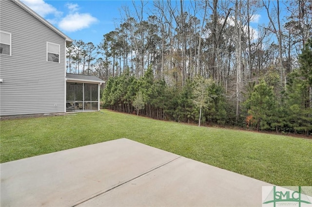 view of yard featuring a patio and a sunroom