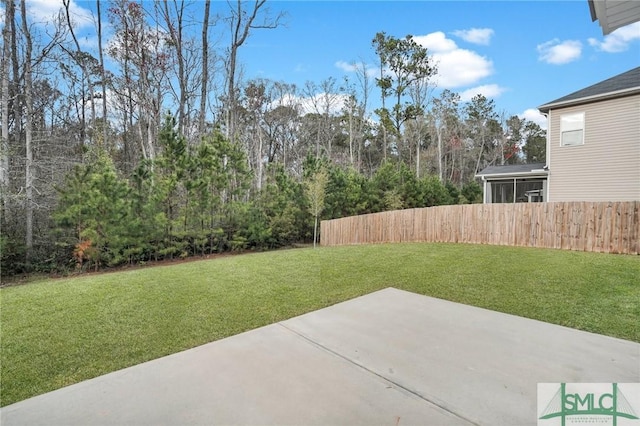 view of yard with a patio and fence