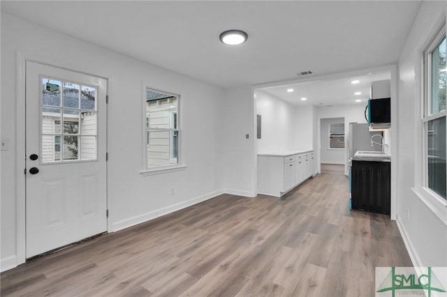 entrance foyer with recessed lighting, wood finished floors, visible vents, and baseboards