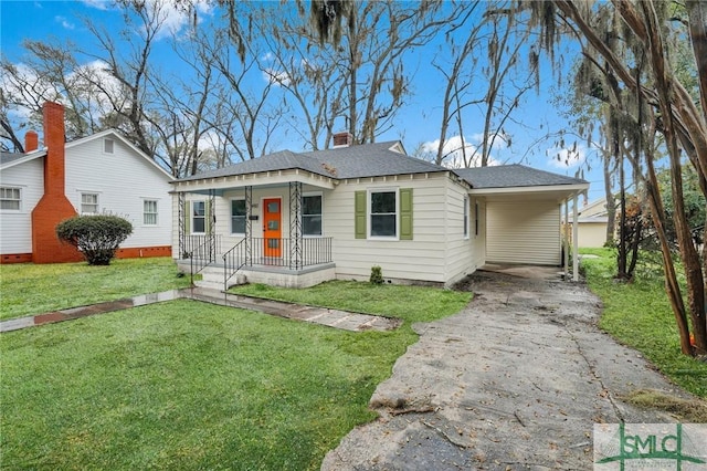 bungalow with a front lawn, covered porch, concrete driveway, an attached carport, and a chimney