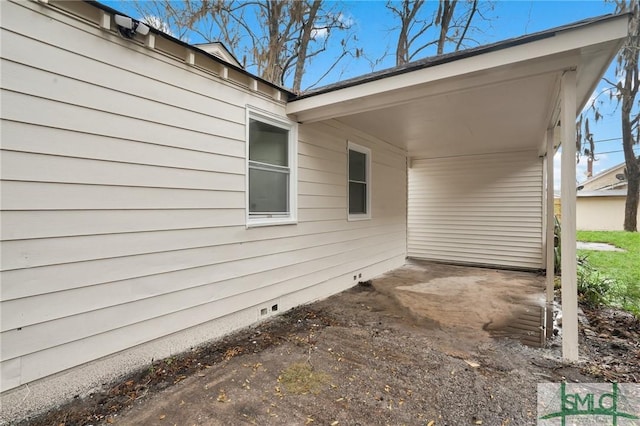 view of patio featuring an attached carport