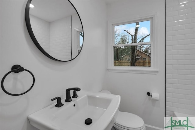 bathroom featuring toilet and a sink