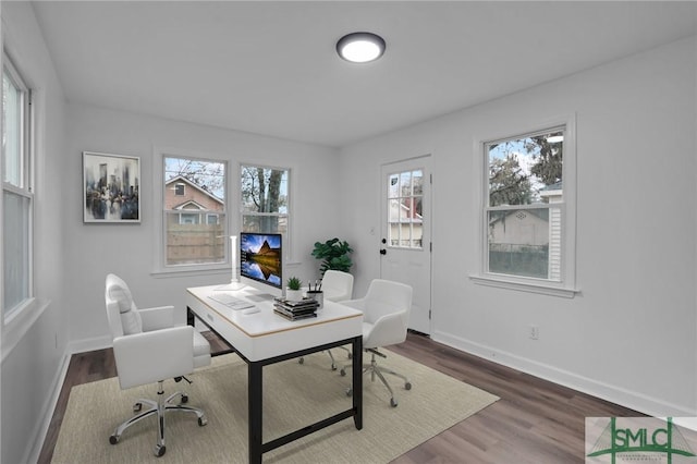 home office with wood finished floors and baseboards