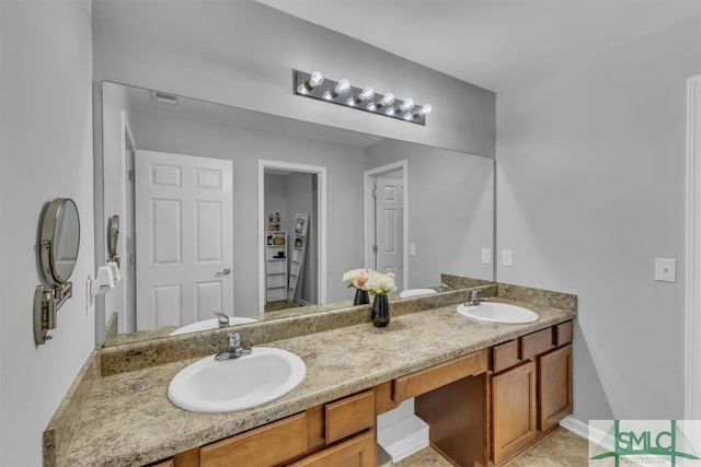 bathroom with double vanity and a sink