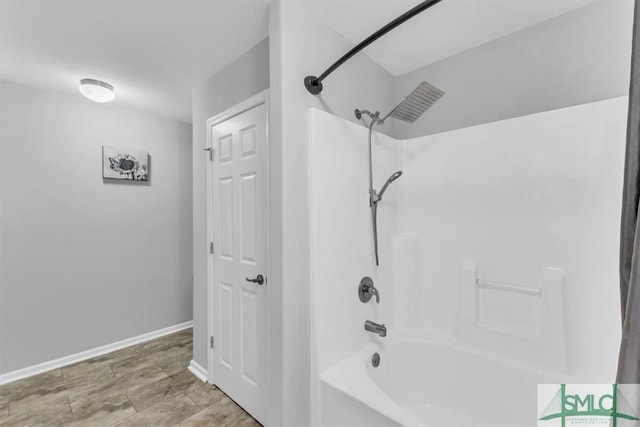 full bathroom featuring bathtub / shower combination, visible vents, and baseboards