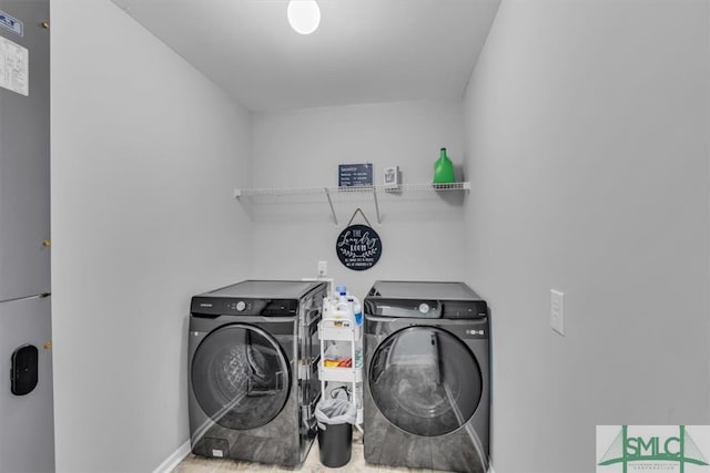 washroom featuring independent washer and dryer and laundry area