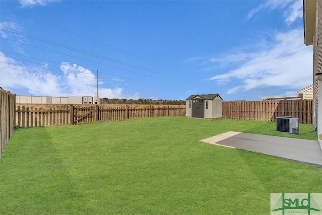 view of yard featuring an outdoor structure, a fenced backyard, and a shed