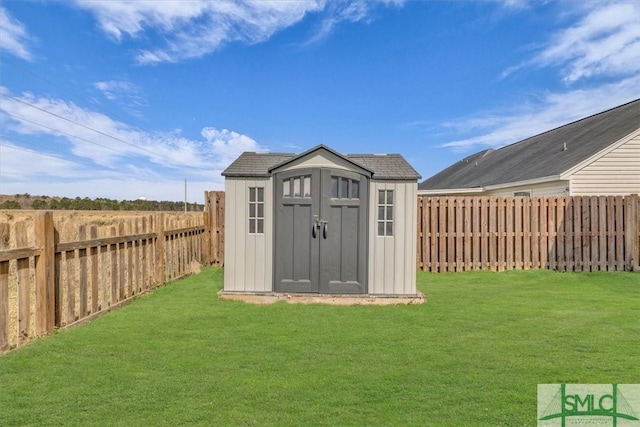 view of shed with a fenced backyard