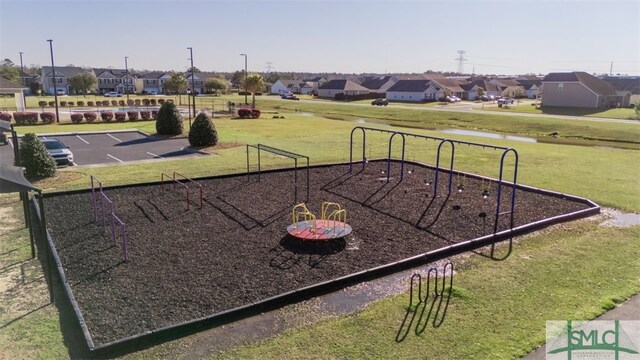 community playground with a yard and a residential view