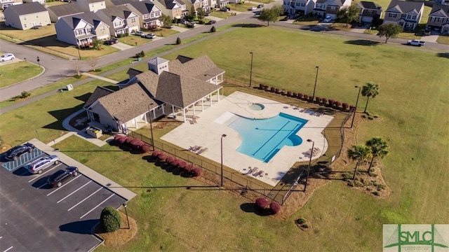 birds eye view of property with a residential view