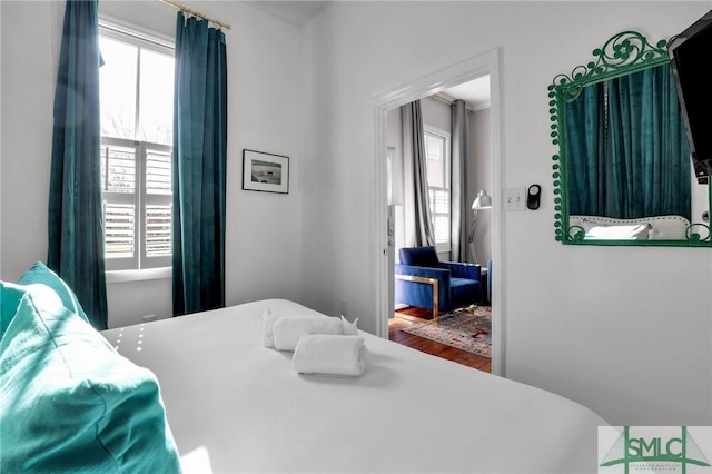 bedroom featuring wood finished floors